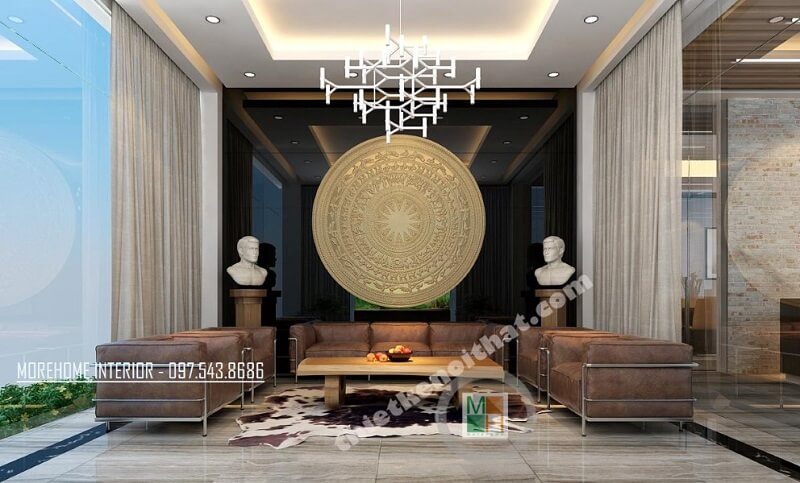 Phòng tiếp khách văn phòng được trang trí ấn tượng bằng đá tự nhiên ốp tường, bộ sofa da cao cấp, đèn trang trí và các phụ kiện khác với tông màu nâu trầm chủ đạo.